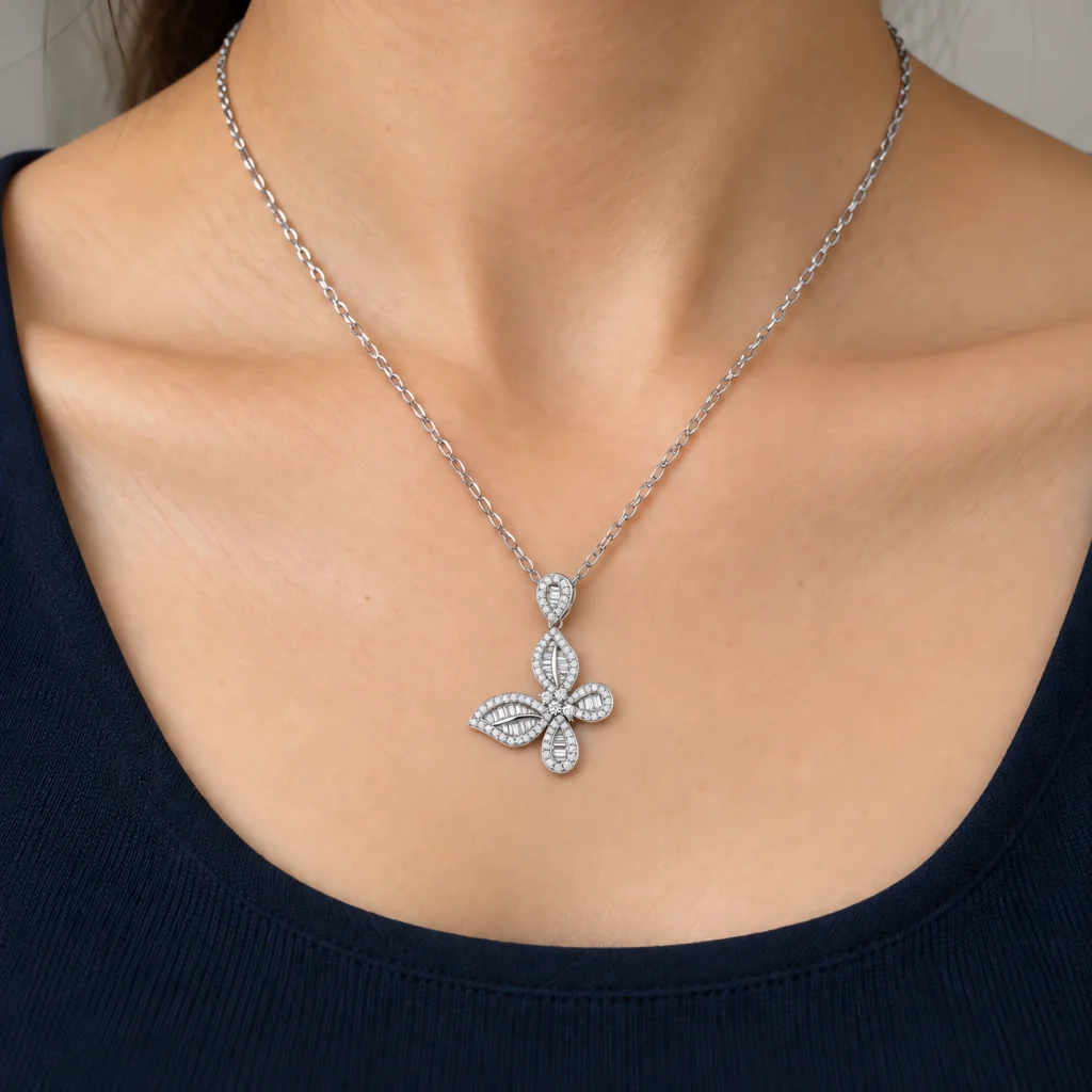 Close-up of a model wearing a 925 sterling silver butterfly pendant necklace set with clear cubic zirconia